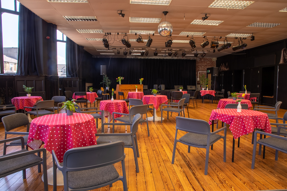 Music Hall set up cabaret style with polka dot table cloths